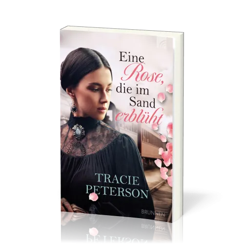 Eine Rose, die im Sand erblüht