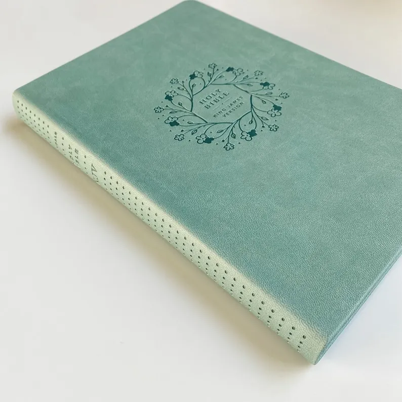 Anglais, Bible, King James Version, similicuir turquoise, motif floral, paroles de Jésus en rouge...
